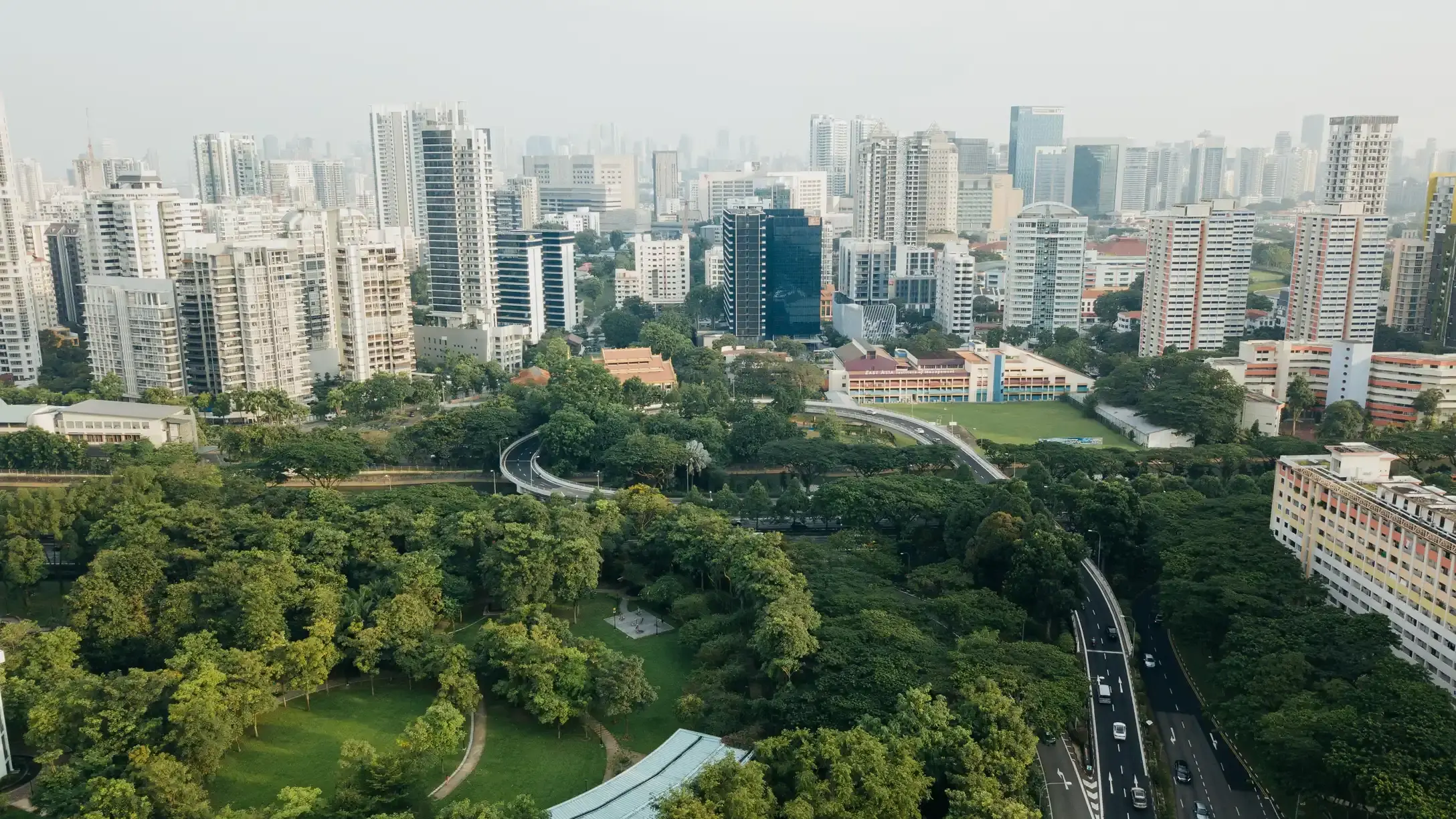 Aerial view of a city skyline surrounded by park land