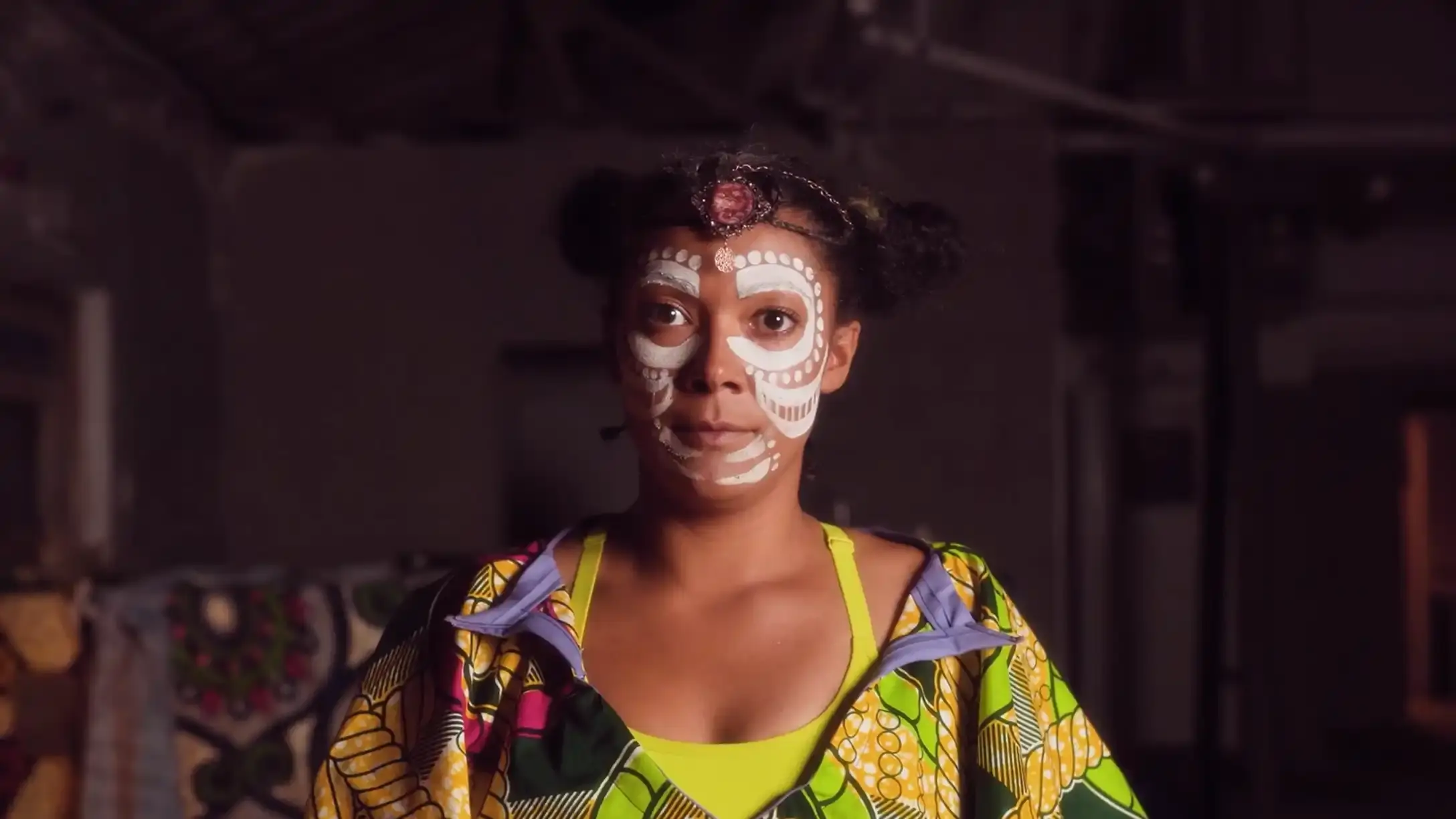 A women wearing white face paint