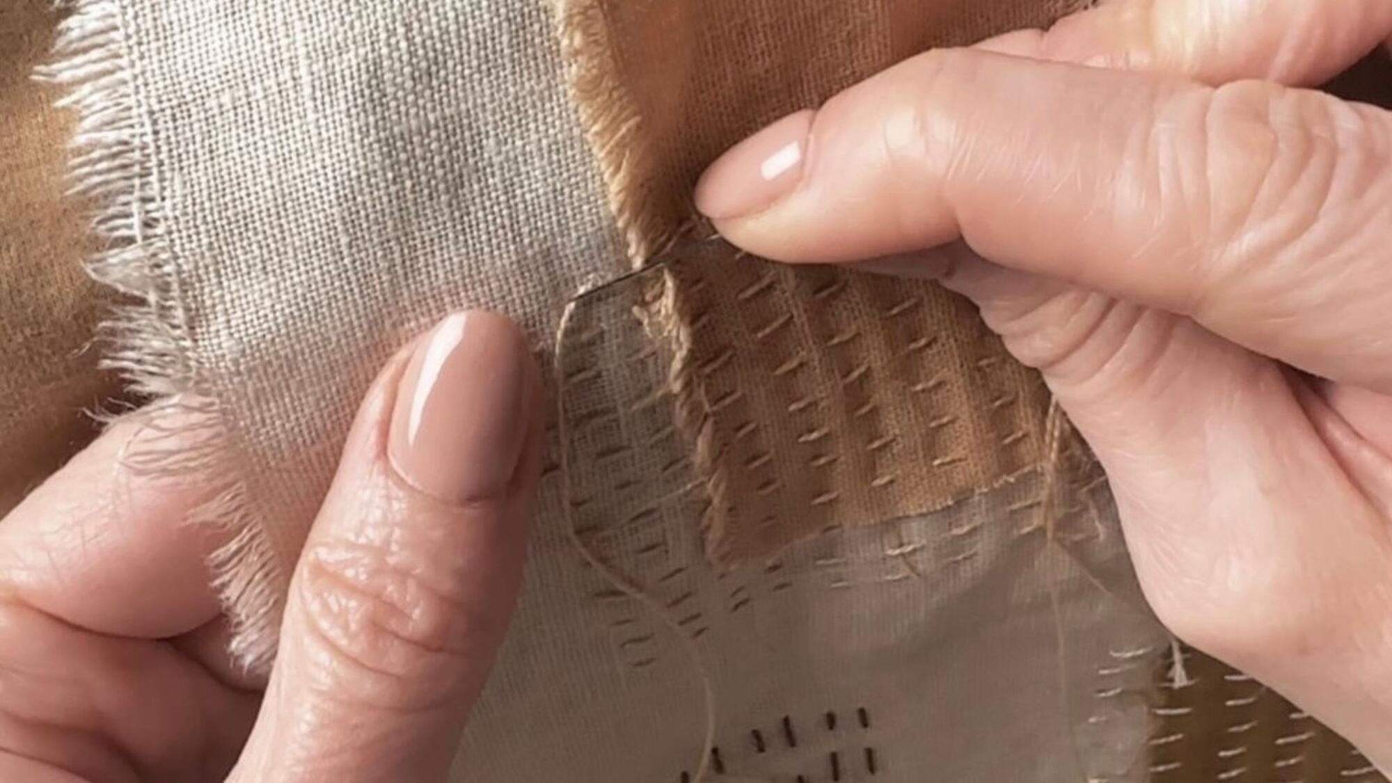 Close-up of hands sewing