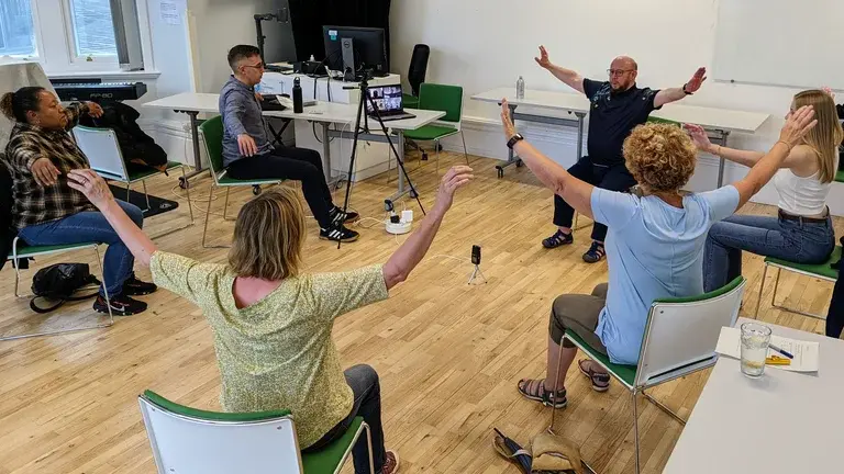 Participants sat in a circle at a Voice Works worskhop