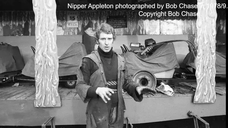 Showman Nipper Appleton standing in front of a fairground ride.