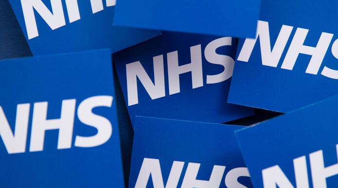 NHS logo repeated in squares