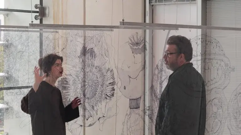 Image of Sheffield-based artist, Jessica Heywood talking to Phil Withington in front of their art installation