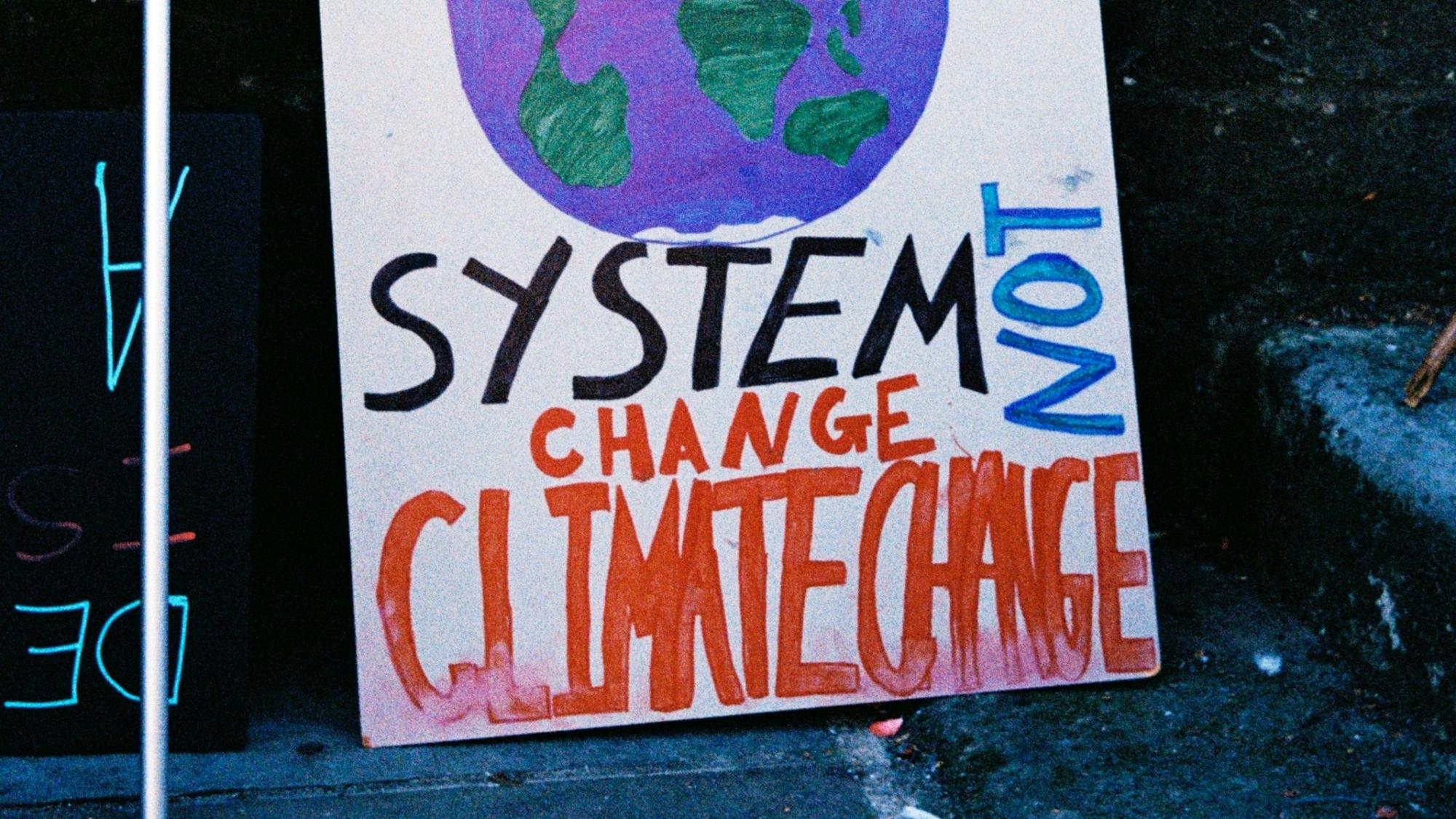 Sign reading 'System change not climate change'