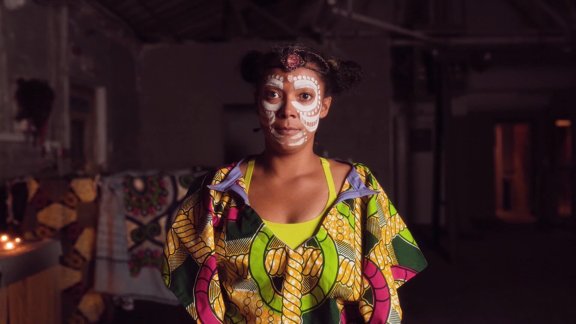 A women wearing white face paint