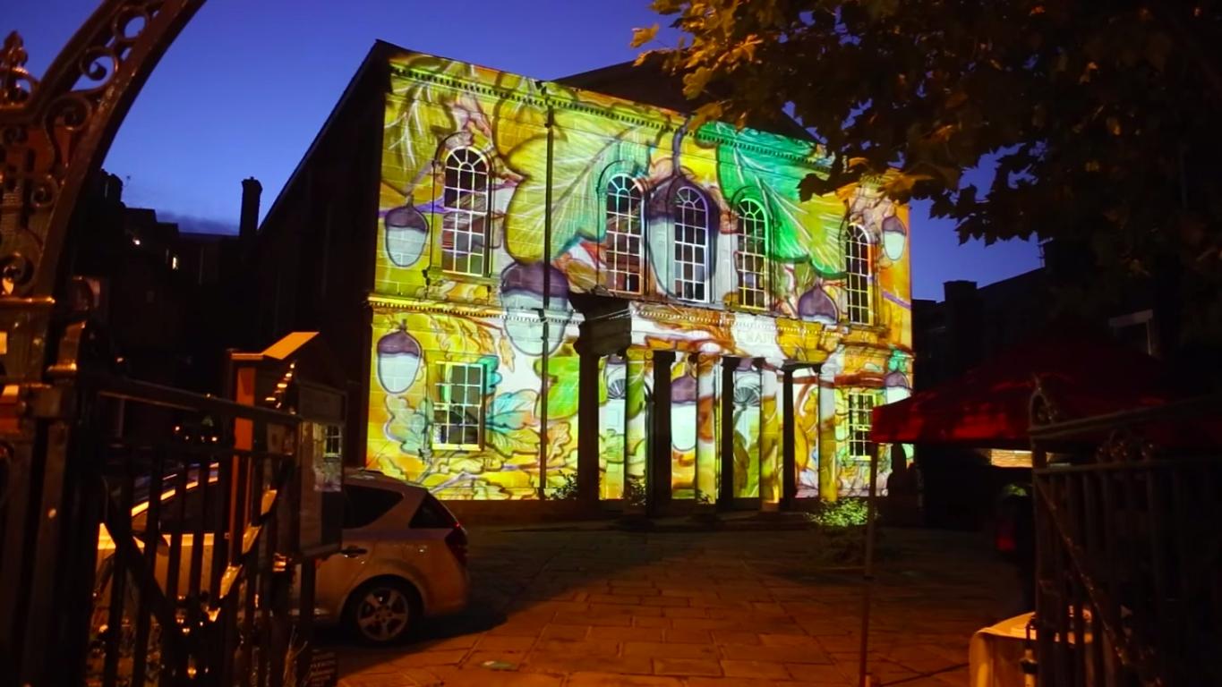 A building with images projected onto it