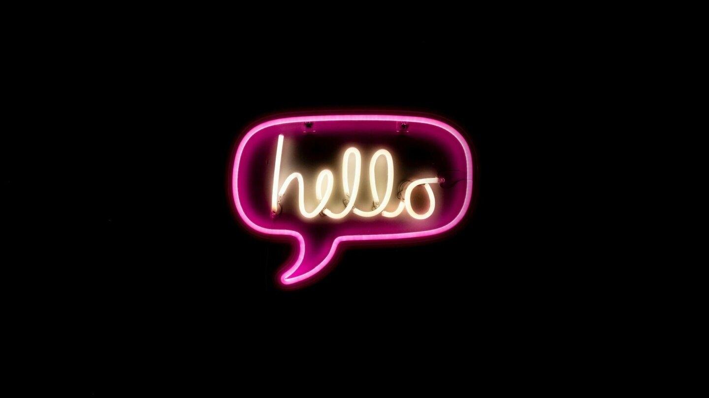 A neon sign reading 'hello'