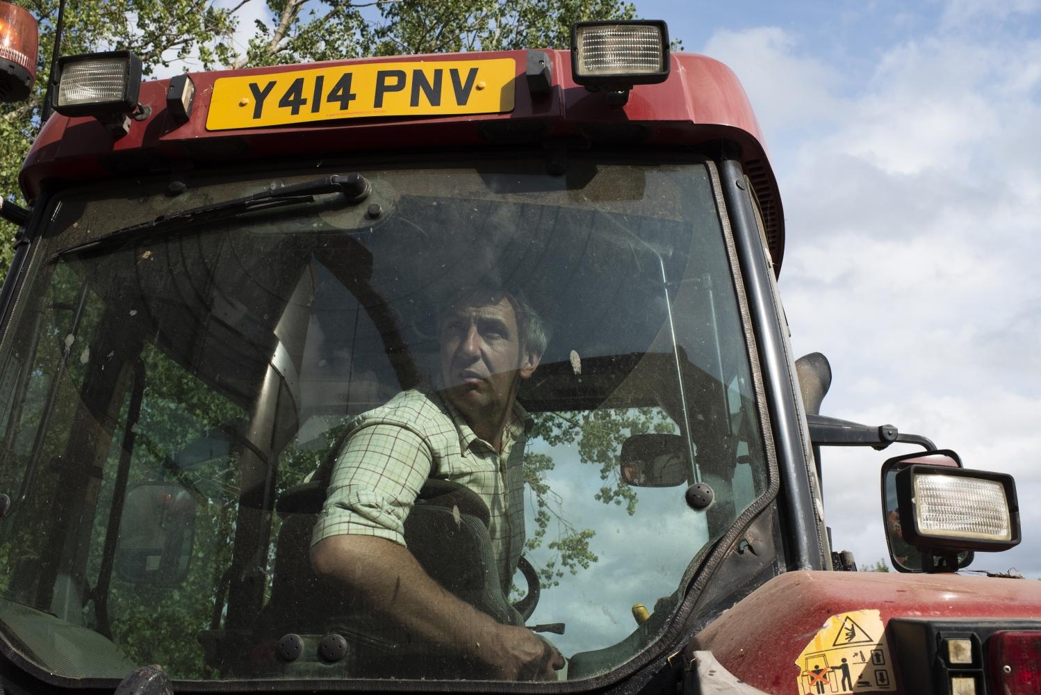 A man in a tractor cab