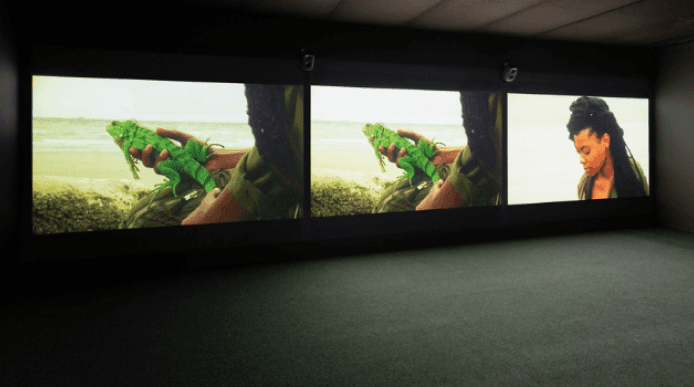 A gallery with images by artist Ursula Mayer projected onto the wall