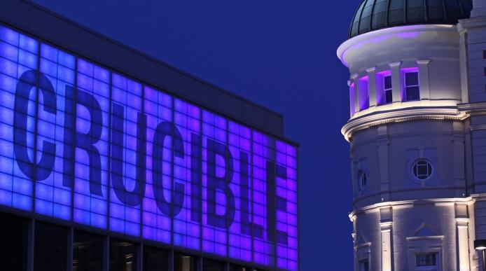 The Crucible and Lyceum theatres lit up at night