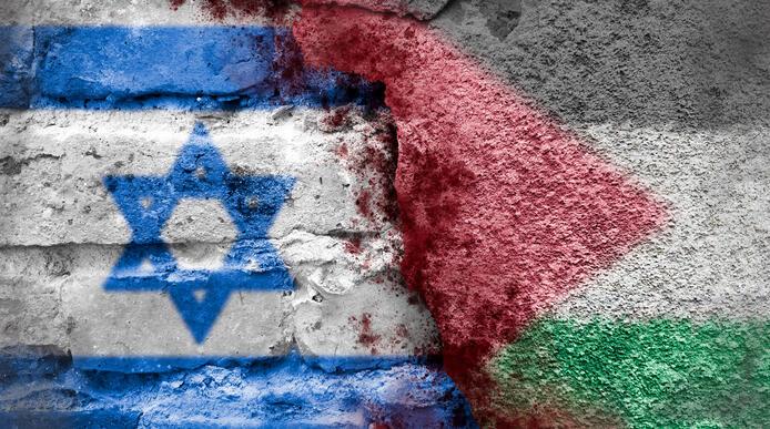 Artistic image of Jewish and Palestine flag with divide between them, on brick texture
